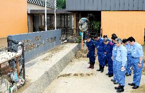 Japan PM Abe visits flood-hit southwestern Japan