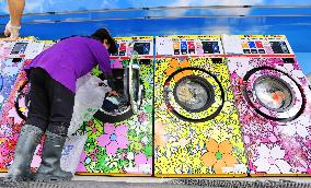 Free laundry in flood-hit southwestern Japan city