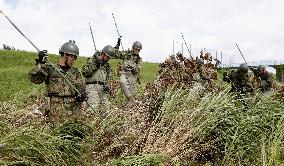 Search operations in flood-hit southwestern Japan