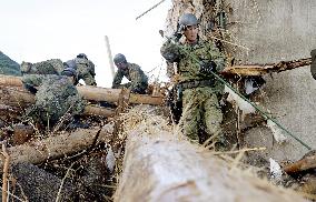 Search operations in flood-hit southwestern Japan