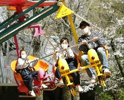 Reopening of Tokyo amusement park after virus-led closure