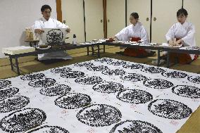 Making of paper charms at western Japan shrine