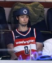 Cubs pitcher Darvish watches NBA game