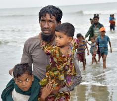 CORRECTED: Rohingya insurgents declare monthlong truce to allow aid delivery