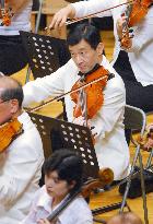 crown Prince Naruhito performs in memorial concert