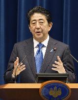 Abe announces sales tax hike delay to October 2019