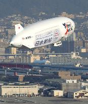 Airship Zeppelin makes test flight over Kobe