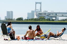Sunbathing in Tokyo seaside park