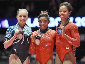 Biles becomes 1st woman to win 3 consecutive world titles