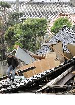 M6.9 quake in Noto -- Man surveys damaged house in Wajima