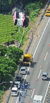 Lorry and coach crash off highway in central Japan