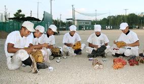 High school baseball team sends used gloves to developing countries