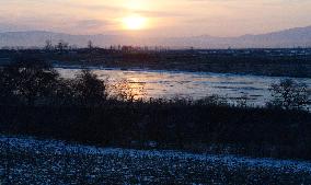 Sun rises over Tumen River along China-N. Korea border
