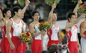 Japan takes silver in men's team event, China wins