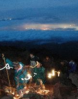 People climb Mt. Fuji