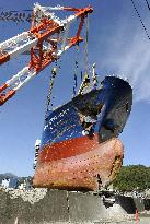 Removing ship after tsunami