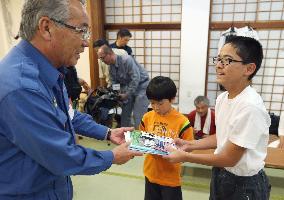 Evacuees from eruption-hit Japanese island stay on nearby island