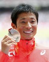 Tanii wins bronze in men's 50-kilometer walk