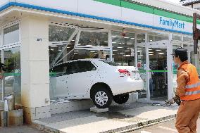 Passenger car crashes into store in Japan