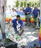 Italian motorcyclists offer paper cranes at Hiroshima monument