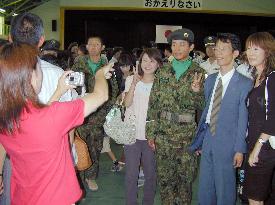 Japanese ground troops return home from Samawah, voice fear