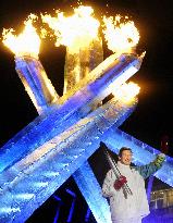 Olympic flame lit at opening ceremony