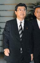 Environment minister Sakihito Ozawa arrives at PM office
