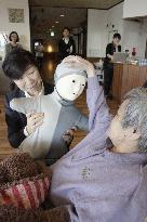 Humanoid robots, IT help improve elderly nursing quality