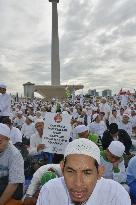 Muslims rally against Jakarta's governor for alleged blasphemy