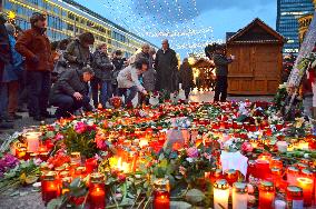 People mourn victims of Christmas market attack