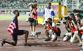 Gay poses after claiming gold double with title in 200