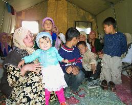 (1)Uzbek refugees say they will never reutrn