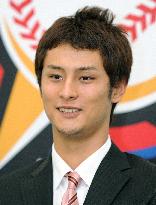 Nippon Ham ace Darvish signs 270 million yen deal