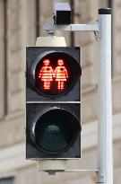 Pedestrian light featuring lesbian couple