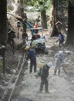 Fixing disaster-hit Shinto shrine before New Year