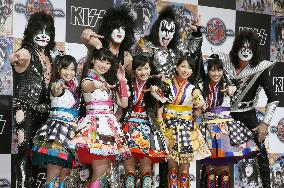 U.S. rock band KISS, Japan's female pop group pose in Tokyo