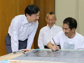 Crown Prince Naruhito speaks to intellectually impaired artist