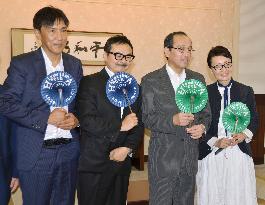 Hiroshima mayor shows fan made of recycled paper cranes