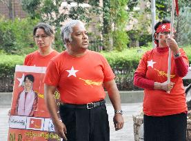 Members of Myanmar's opposition NLD rally in Tokyo ahead of election