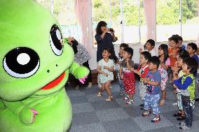 TV mascot character entertains kids at Fukushima child center