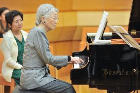 Empress Michiko plays piano during music workshop in eastern Japan