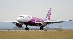 1st airplane of Peach Aviation arrives at Kansai airport
