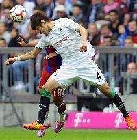 Hanover's Japan defender Sakai in action against Munich