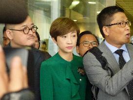 CORRECTED: H.K. pro-democracy protest activists face "nuisance" charges in court
