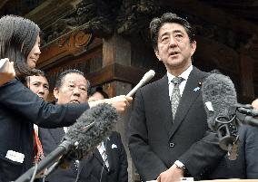Abe vows to welcome tourists with more tax-free shops, speedy customs