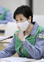 Tokyo lowers coronavirus alert level