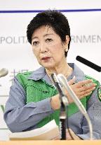 Tokyo lowers coronavirus alert level