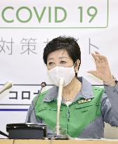 Tokyo lowers coronavirus alert level