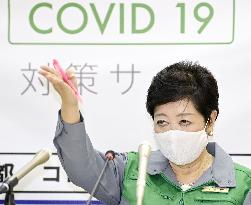 Tokyo lowers coronavirus alert level