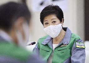 Tokyo lowers coronavirus alert level